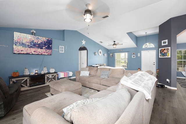 living room featuring ceiling fan, wood-type flooring, and vaulted ceiling