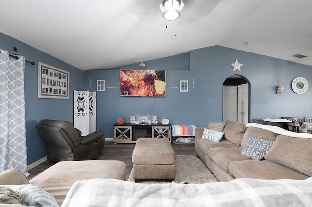 living room featuring wood-type flooring and lofted ceiling