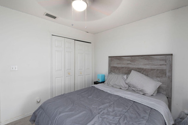 bedroom featuring carpet floors, a closet, and ceiling fan