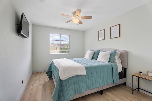 bedroom featuring light hardwood / wood-style floors and ceiling fan