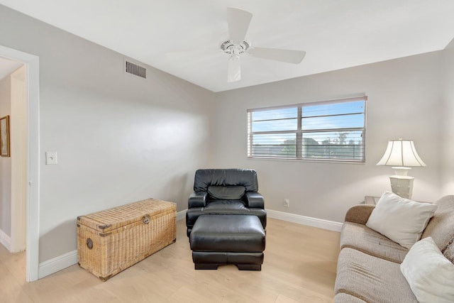 2300 NE 1st Ln Unit 307, Boynton Beach, FL 33435 - sitting room with light wood-type flooring, ceiling fan, and baseboards