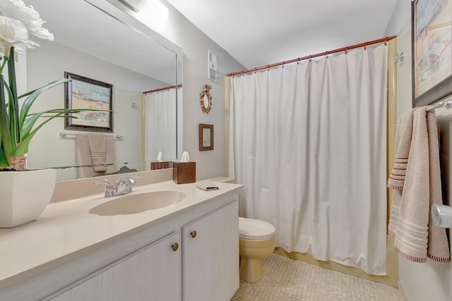 2300 NE 1st Ln Unit 307, Boynton Beach, FL 33435 - full bath featuring toilet, vanity, tile patterned floors, and curtained shower