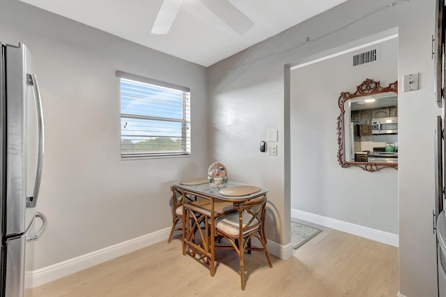 2300 NE 1st Ln Unit 307, Boynton Beach, FL 33435 - dining space with light wood-type flooring, ceiling fan, and baseboards