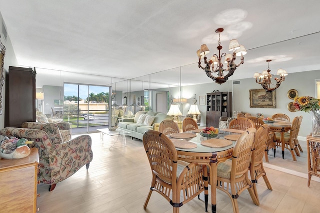 2300 NE 1st Ln Unit 307, Boynton Beach, FL 33435 - dining space featuring a chandelier