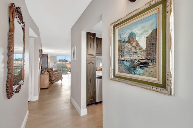 2300 NE 1st Ln Unit 307, Boynton Beach, FL 33435 - hall with light wood finished floors and baseboards