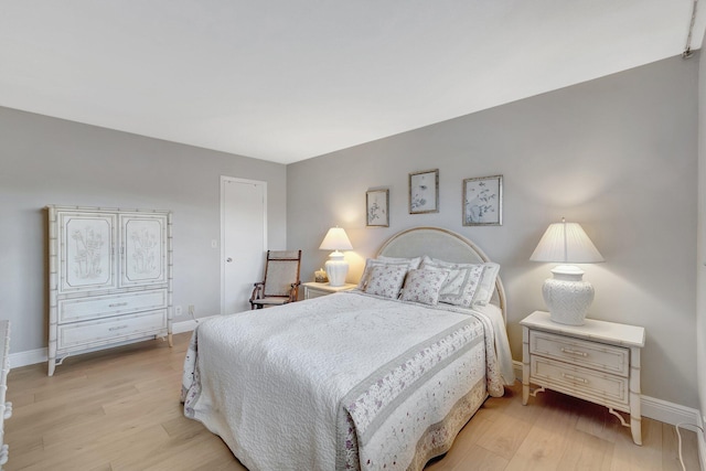 2300 NE 1st Ln Unit 307, Boynton Beach, FL 33435 - bedroom with light wood-style flooring and baseboards