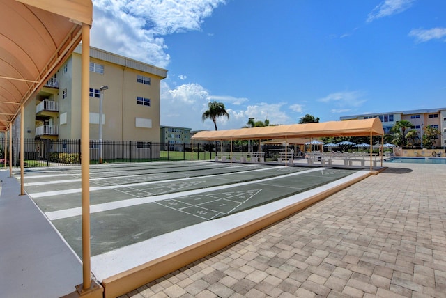 2300 NE 1st Ln Unit 307, Boynton Beach, FL 33435 - view of property's community featuring shuffleboard and uncovered parking