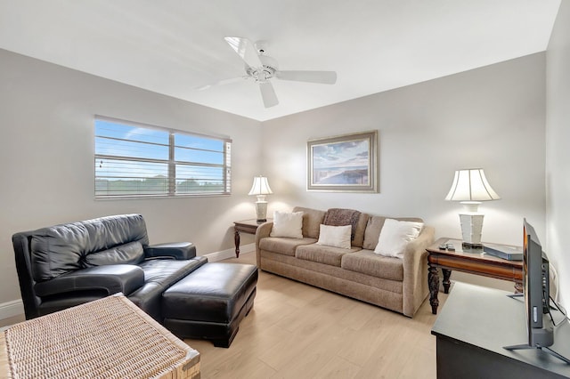 2300 NE 1st Ln Unit 307, Boynton Beach, FL 33435 - living room featuring light wood-type flooring, ceiling fan, and baseboards