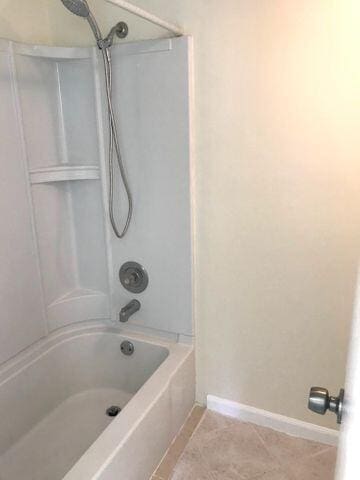 bathroom featuring  shower combination and tile patterned floors