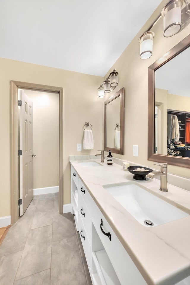 bathroom with tile patterned flooring and vanity