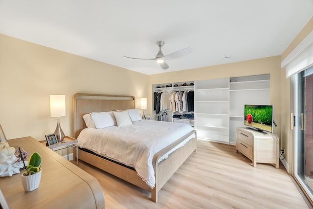 bedroom with a closet, light hardwood / wood-style flooring, and ceiling fan