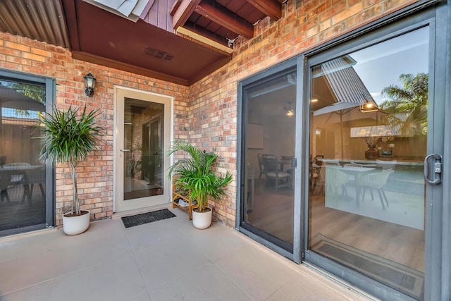 entrance to property with a patio area