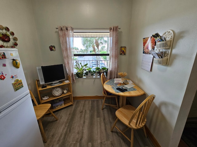 dining area featuring dark hardwood / wood-style flooring