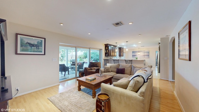 living room with light hardwood / wood-style floors