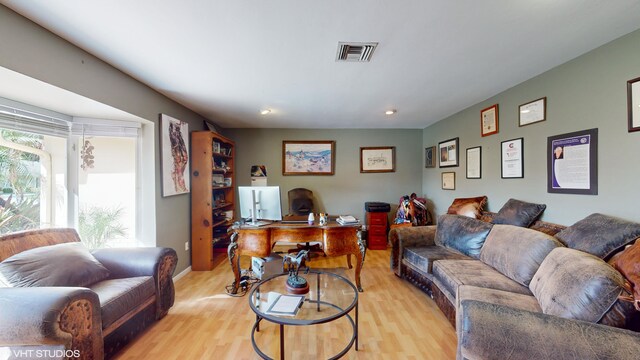 living room with light hardwood / wood-style flooring