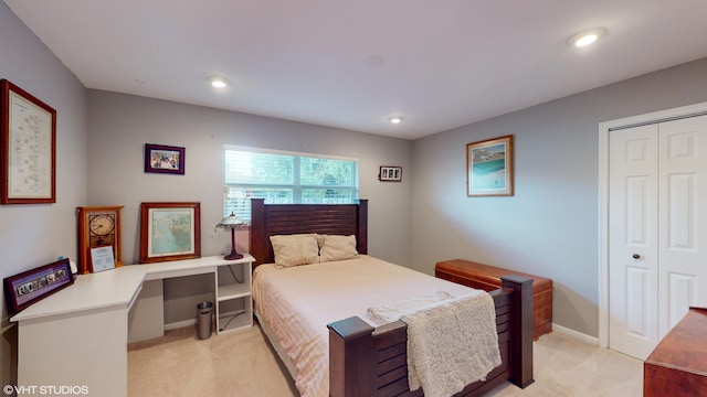 carpeted bedroom with a closet