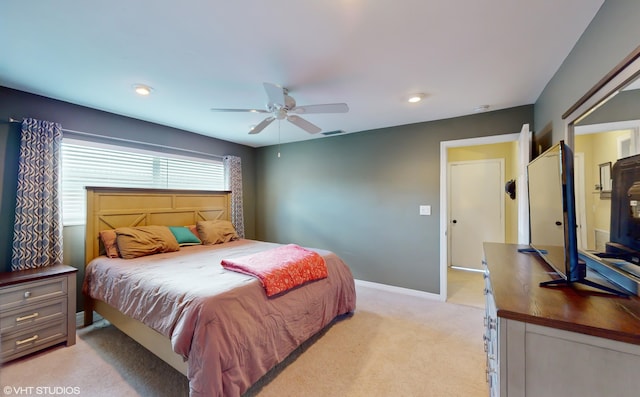 bedroom with light carpet and ceiling fan