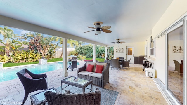 view of patio featuring an outdoor living space and a fenced in pool