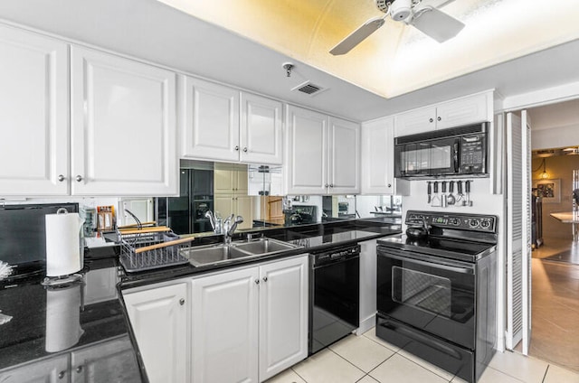 kitchen with white cabinets, sink, and black appliances