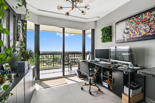 office space featuring a wall of windows, a textured ceiling, and an inviting chandelier