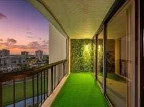 view of balcony at dusk