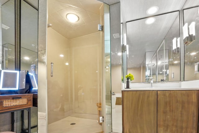 bathroom featuring vanity and an enclosed shower