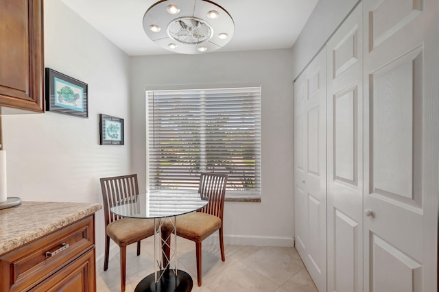 dining area with light tile patterned floors