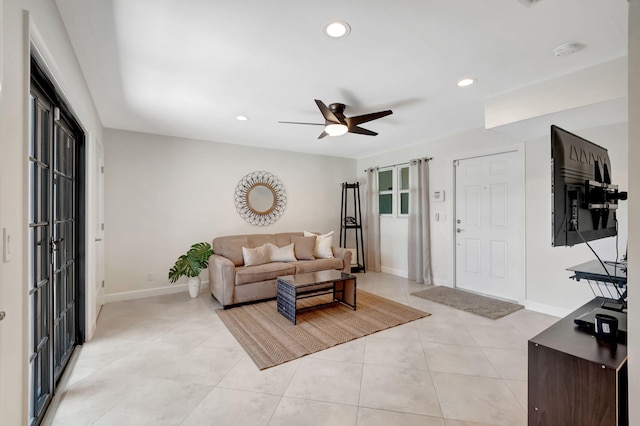 tiled living room featuring ceiling fan