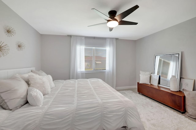 bedroom with ceiling fan and light colored carpet