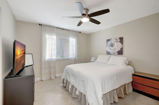 bedroom with ceiling fan and light tile patterned flooring