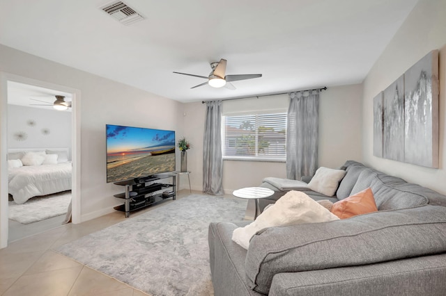 tiled living room with ceiling fan