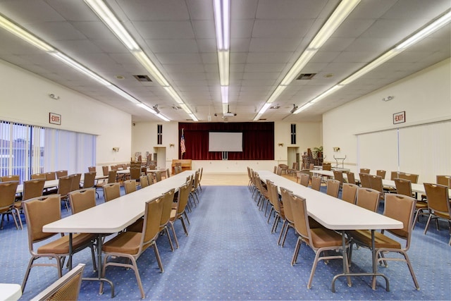 dining space with a drop ceiling