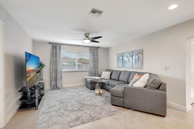 living room with light tile patterned floors and ceiling fan