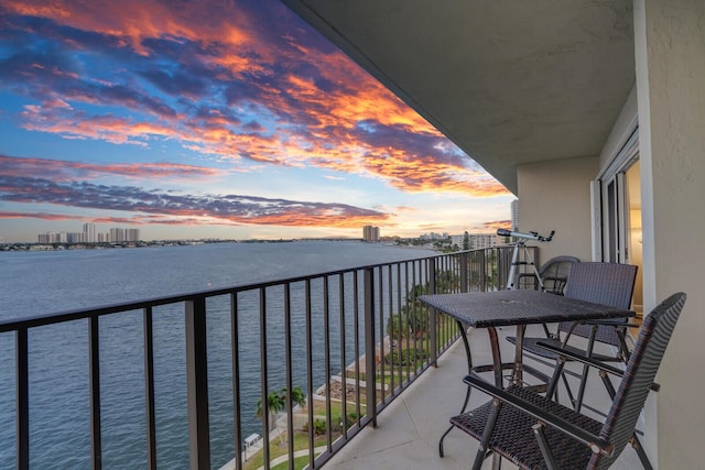 balcony at dusk with a water view