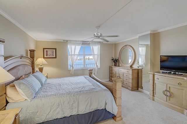 bedroom with ceiling fan, light carpet, and ornamental molding