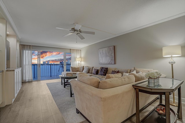 living room with ceiling fan, light hardwood / wood-style floors, and ornamental molding