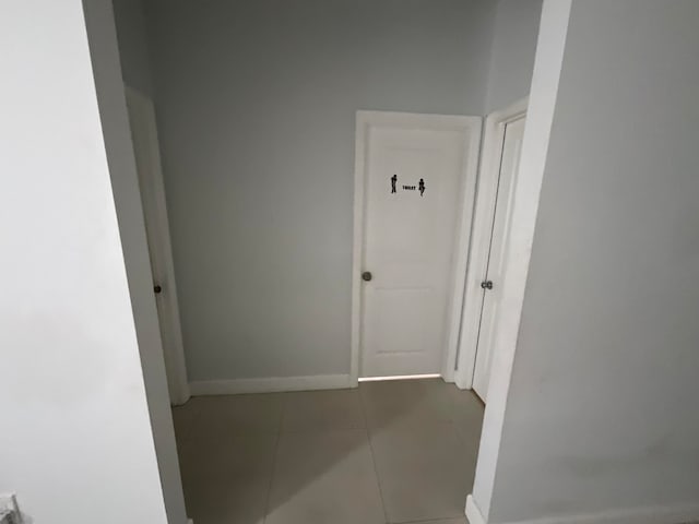 corridor featuring tile patterned floors