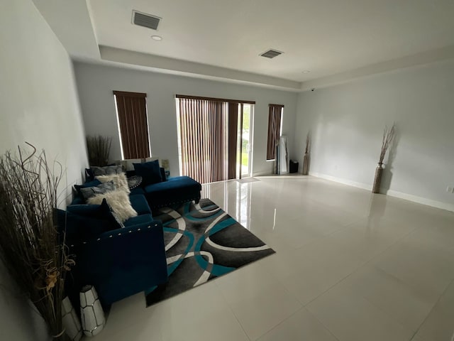 living room with tile patterned flooring