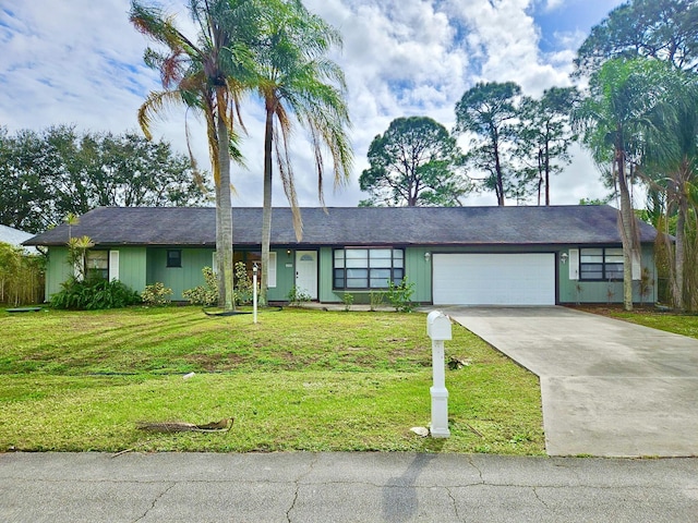 ranch-style home with a garage and a front yard