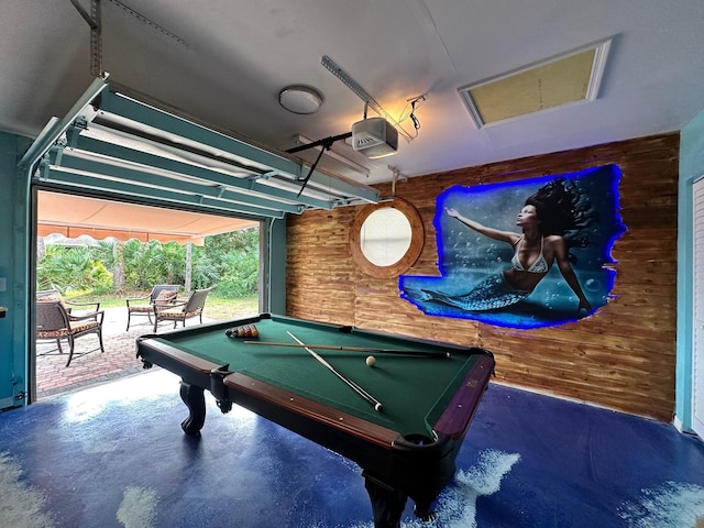 rec room with wooden walls and pool table