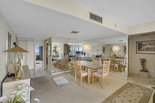 dining space with a textured ceiling