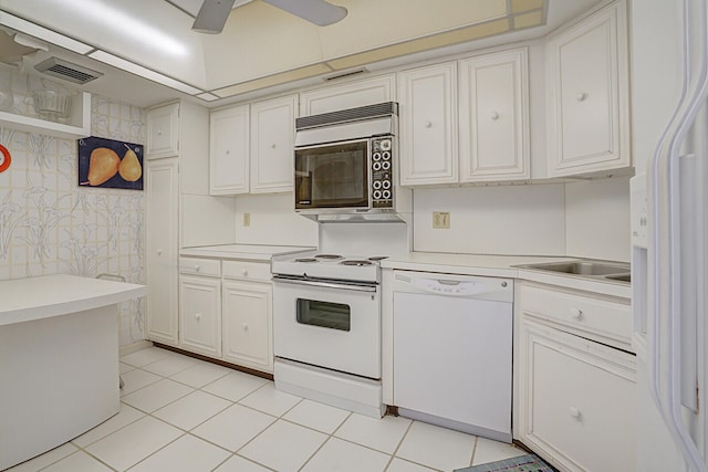 kitchen featuring white cabinets, ceiling fan, white appliances, and light tile patterned floors