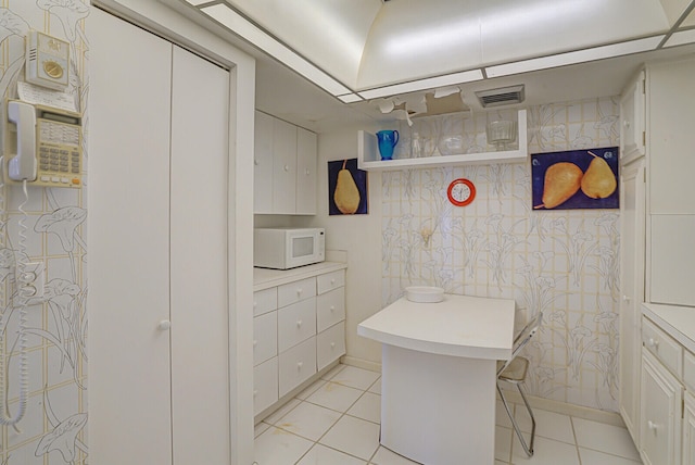 bathroom with tile patterned floors