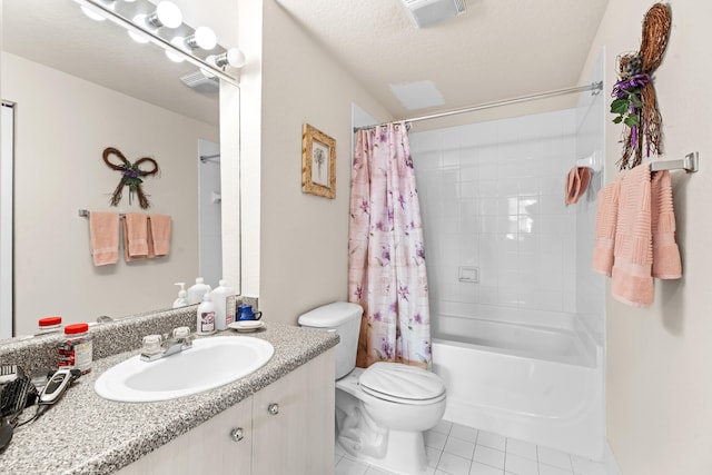 full bathroom featuring a textured ceiling, vanity, shower / tub combo with curtain, tile patterned flooring, and toilet