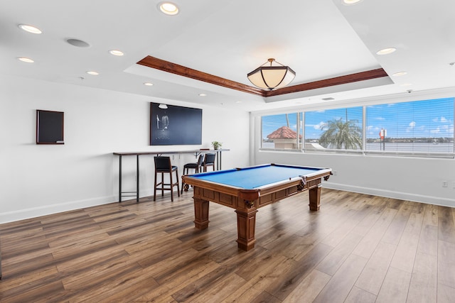 rec room featuring a tray ceiling, billiards, and hardwood / wood-style flooring