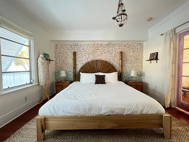 bedroom with dark hardwood / wood-style floors and crown molding