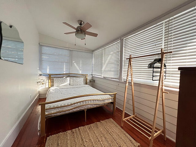 bedroom with hardwood / wood-style floors, ceiling fan, and lofted ceiling