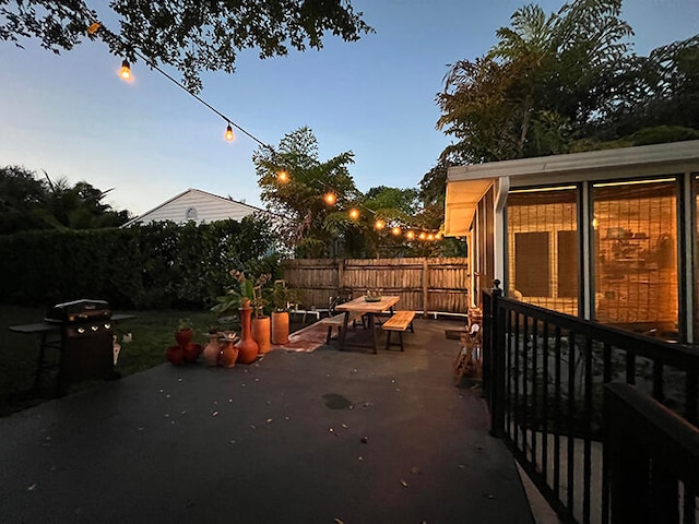 view of patio terrace at dusk