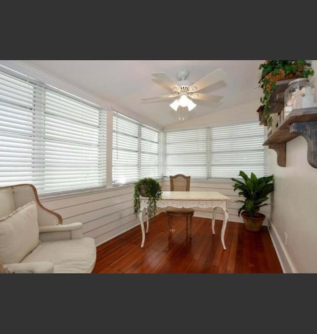 sunroom featuring ceiling fan