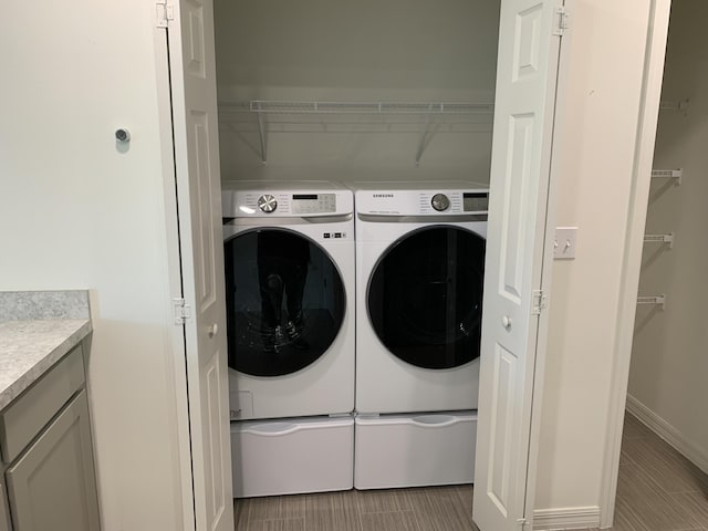 laundry area with washing machine and dryer